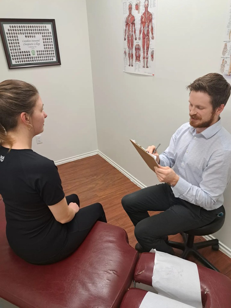 Client discussing North Vancouver Chiropractic care treatments.